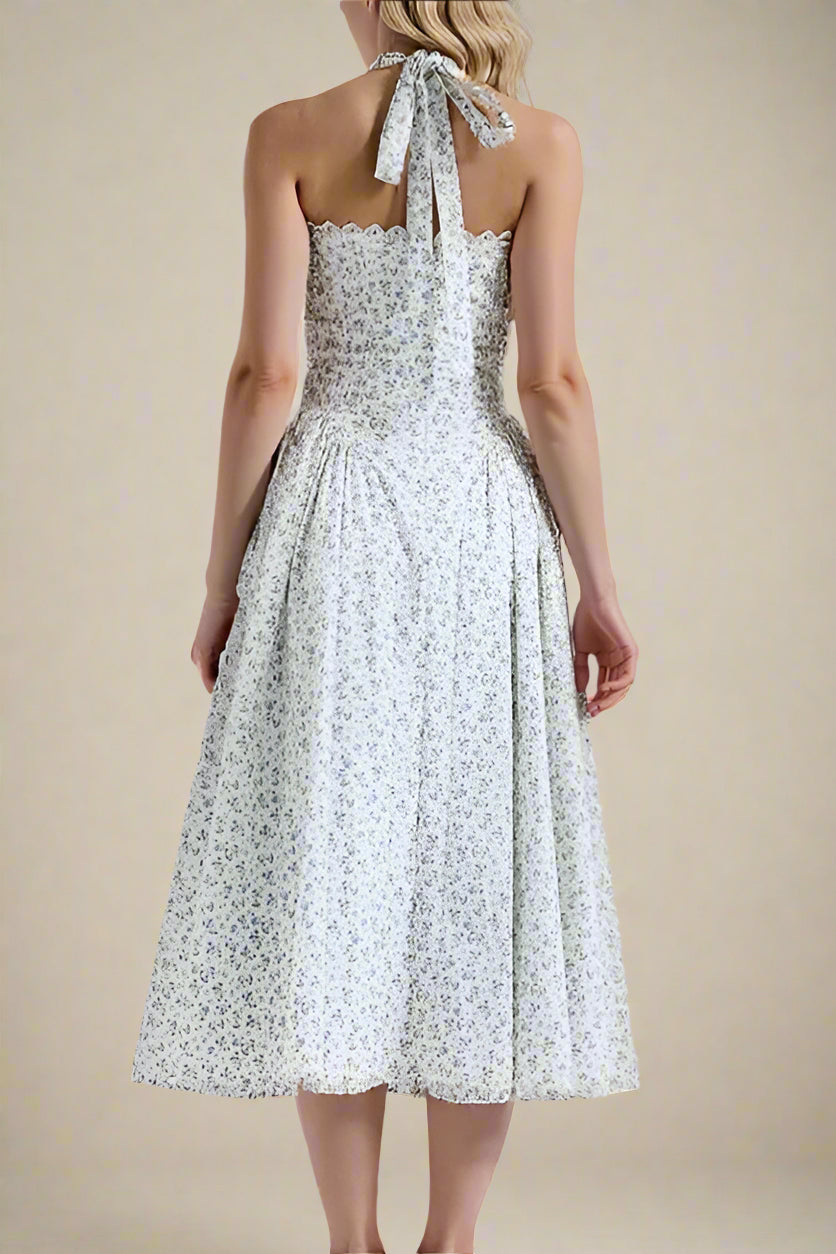 Woman wearing a figure flattering Lynsie Bodycon Midi Dress - Blue Floral BODYCON COLLECTION