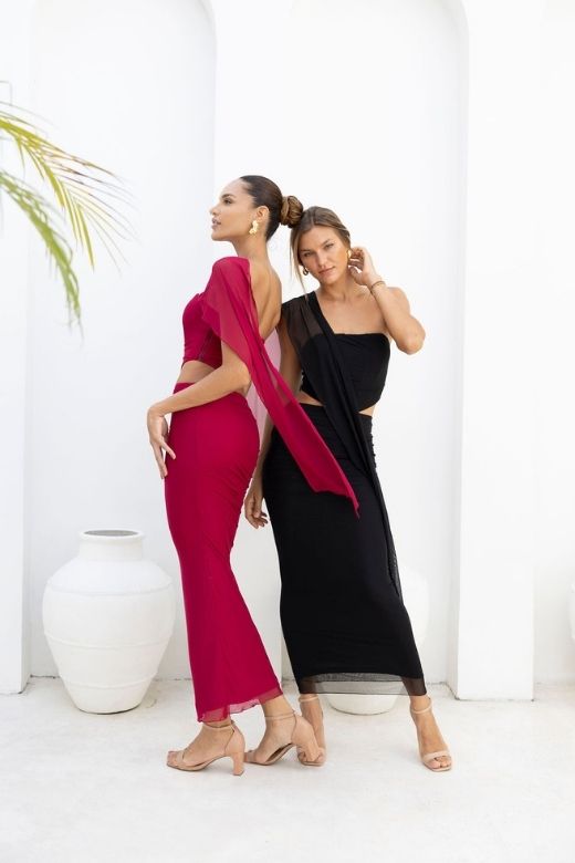 Woman wearing a figure flattering Margot Wrap Top and Maxi Skirt Outfit Set - Lipstick Red BODYCON COLLECTION