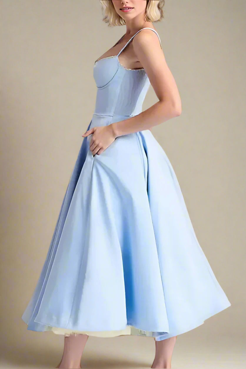 Woman wearing a figure flattering Mavis Bodycon Midi Dress - Baby Blue BODYCON COLLECTION