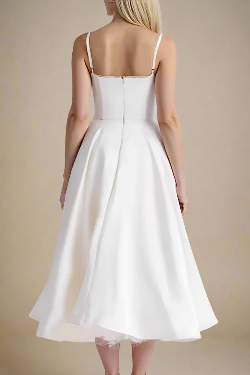 Woman wearing a figure flattering Mavis Bodycon Midi Dress - Cream BODYCON COLLECTION