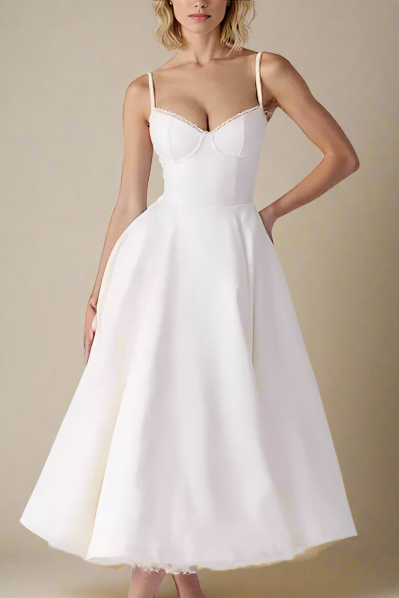 Woman wearing a figure flattering Mavis Bodycon Midi Dress - Cream BODYCON COLLECTION