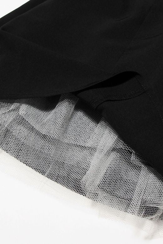 Woman wearing a figure flattering Mavis Bodycon Mini Dress - Classic Black BODYCON COLLECTION