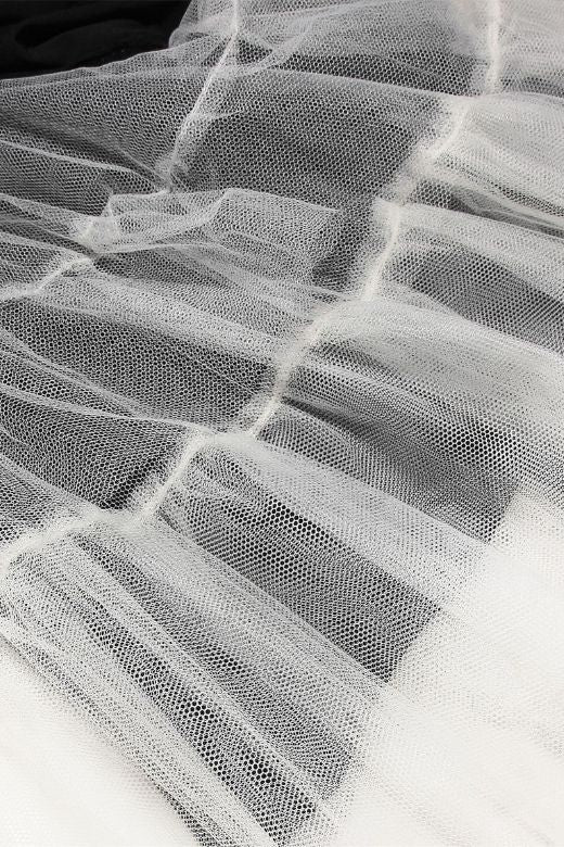 Woman wearing a figure flattering Mavis Bodycon Mini Dress - Classic Black BODYCON COLLECTION