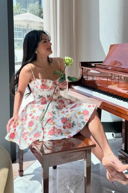 Woman wearing a figure flattering Mavis Bodycon Mini Dress - Classic Black BODYCON COLLECTION