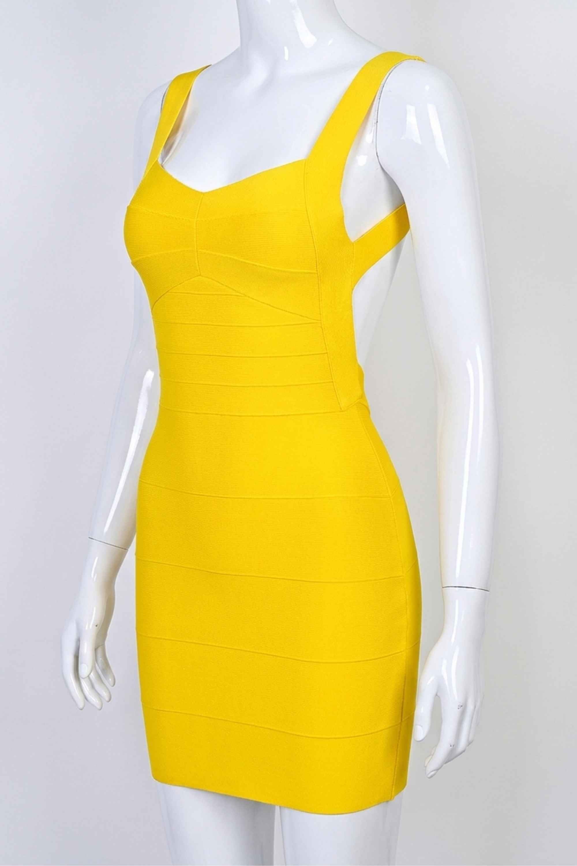 Woman wearing a figure flattering Maya Bandage Mini Dress - Sun Yellow BODYCON COLLECTION