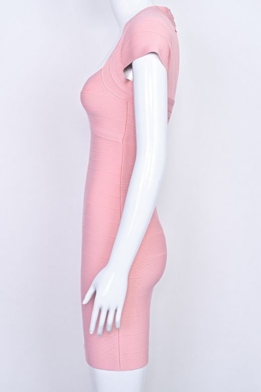 Woman wearing a figure flattering Miranda Bandage Mini Dress - Ballet Pink Bodycon Collection