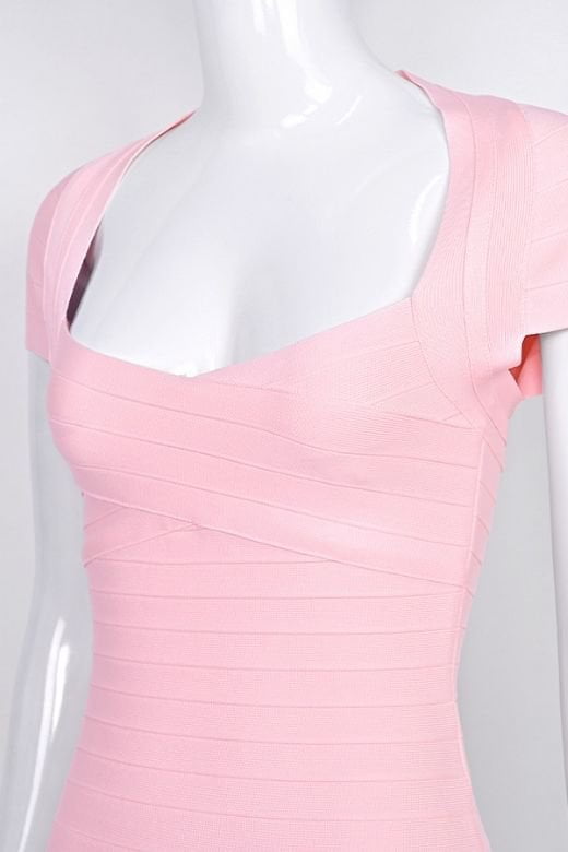 Woman wearing a figure flattering Miranda Bandage Mini Dress - Dusty Pink Bodycon Collection