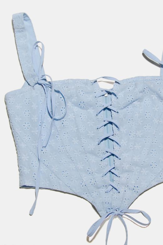 Woman wearing a figure flattering Misty Bodycon Mini Dress - Baby Blue BODYCON COLLECTION