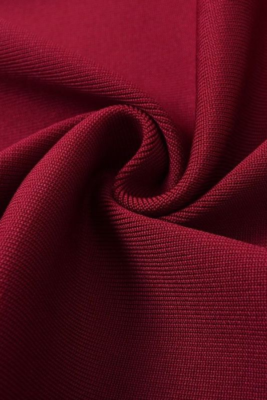 Woman wearing a figure flattering Molly Bandage Midi Dress - Red Wine BODYCON COLLECTION