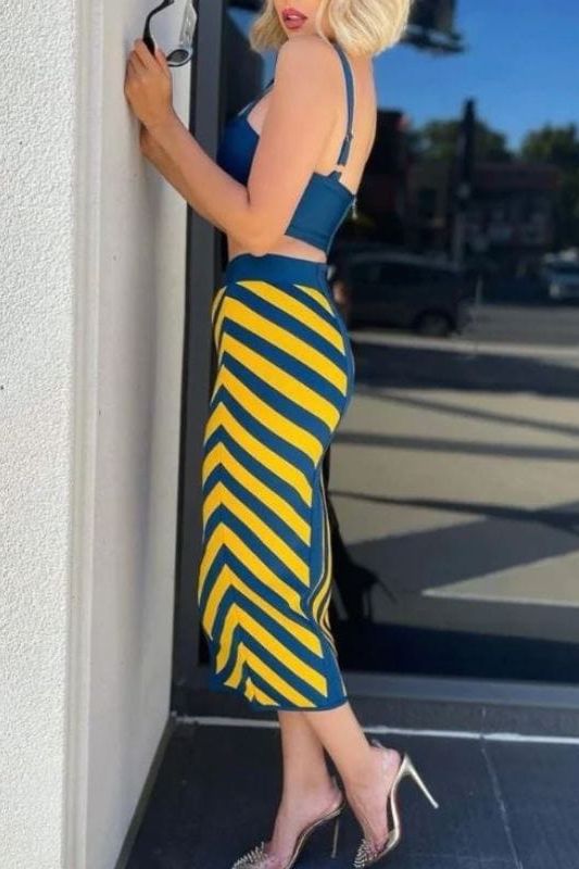 Woman wearing a figure flattering Nadia Bandage Crop Top and Midi Skirt Set - Royal Blue BODYCON COLLECTION