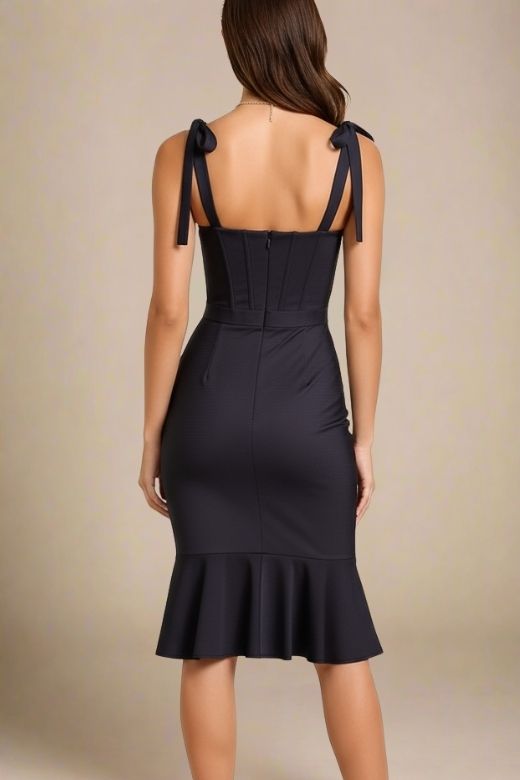 Woman wearing a figure flattering Nora Bandage Midi Dress - Classic Black BODYCON COLLECTION