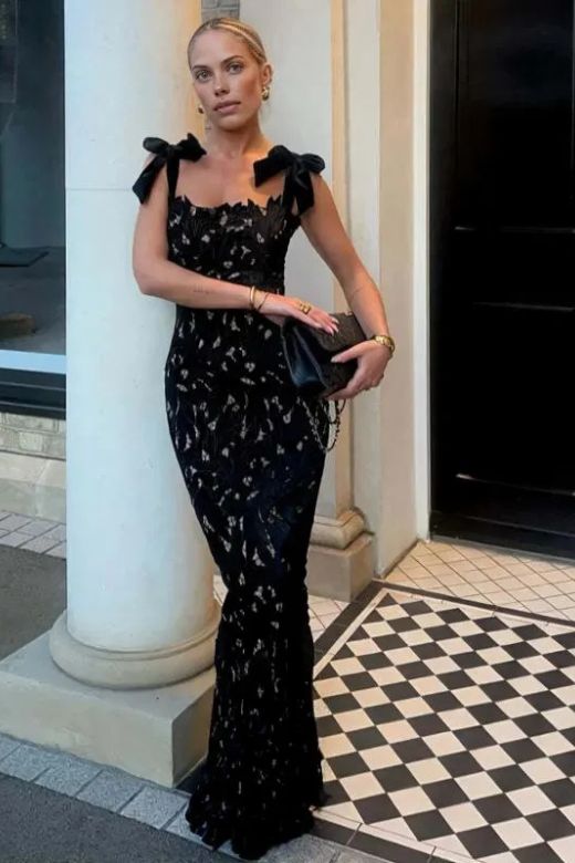 Woman wearing a figure flattering Odette Bodycon Lace Maxi Dress - Classic Black BODYCON COLLECTION