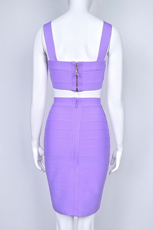 Woman wearing a figure flattering Ophelia Bandage Crop Top and Skirt Set - Violet BODYCON COLLECTION Pty Ltd