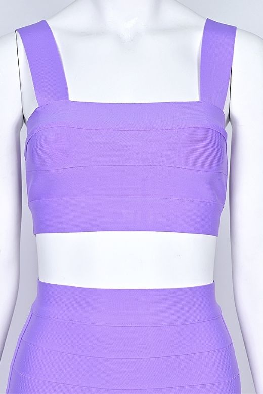 Woman wearing a figure flattering Ophelia Bandage Crop Top and Skirt Set - Violet BODYCON COLLECTION Pty Ltd