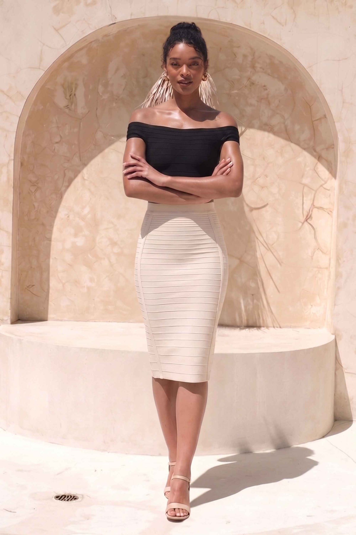 Woman wearing a figure flattering Pencil High Waist Bandage Knee Length Knitted Skirt - Cream BODYCON COLLECTION