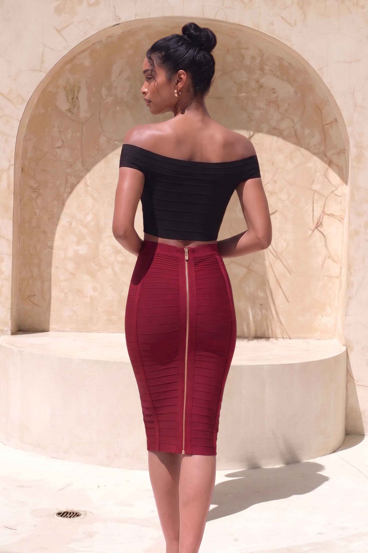 Woman wearing a figure flattering Pencil High Waist Bandage Knee Length Knitted Skirt - Red Wine BODYCON COLLECTION