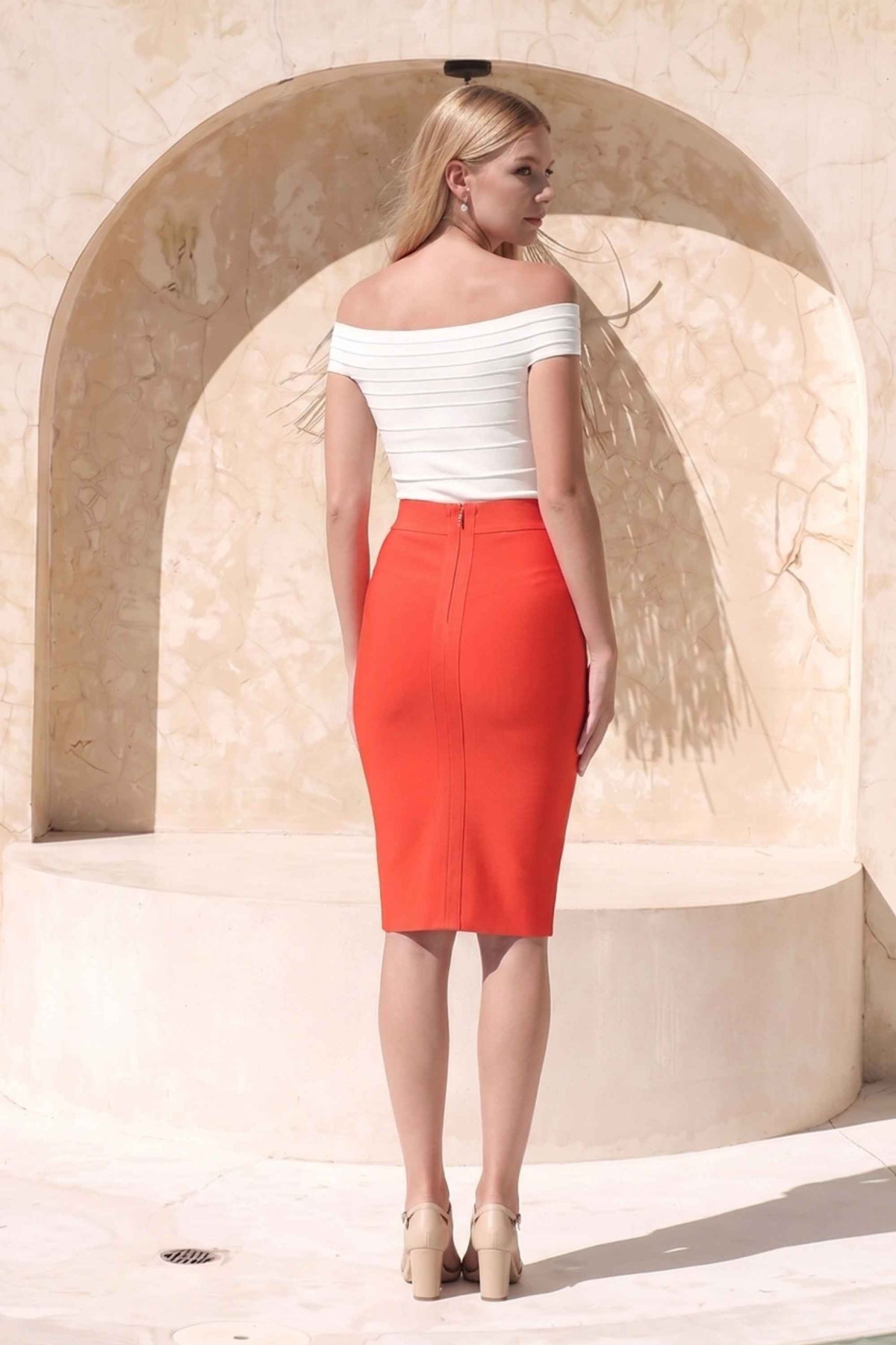 Woman wearing a figure flattering Pencil High Waist Bandage Knee Length Skirt - Lipstick Red BODYCON COLLECTION
