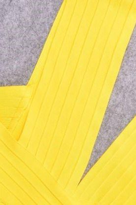 Woman wearing a figure flattering Pia Bandage Dress - Sun Yellow BODYCON COLLECTION