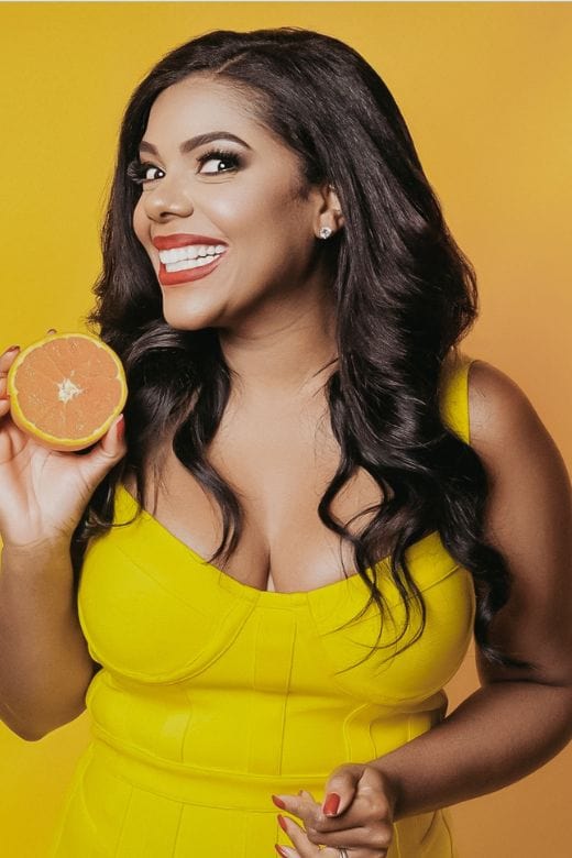 Woman wearing a figure flattering Pip Bandage Corset Dress - Sun Yellow Bodycon Collection