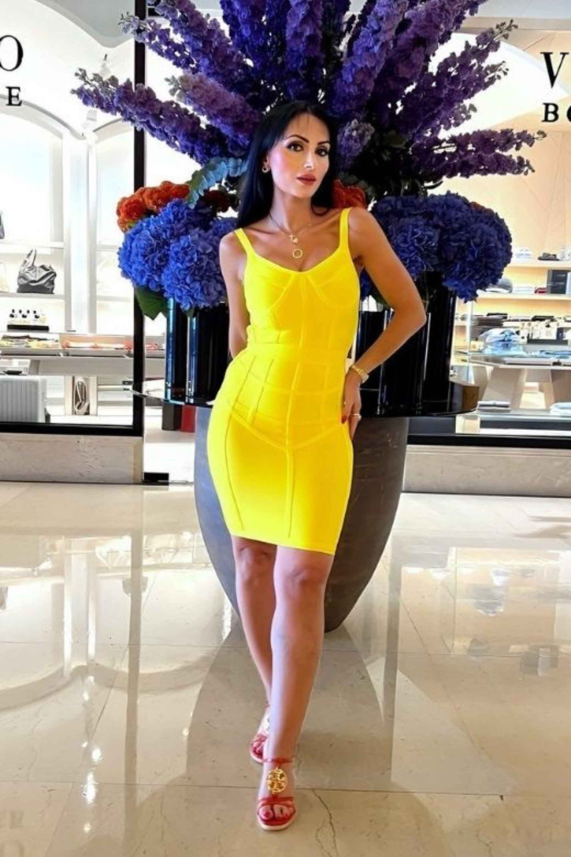 Woman wearing a figure flattering Pip Bandage Mini Dress - Sun Yellow BODYCON COLLECTION