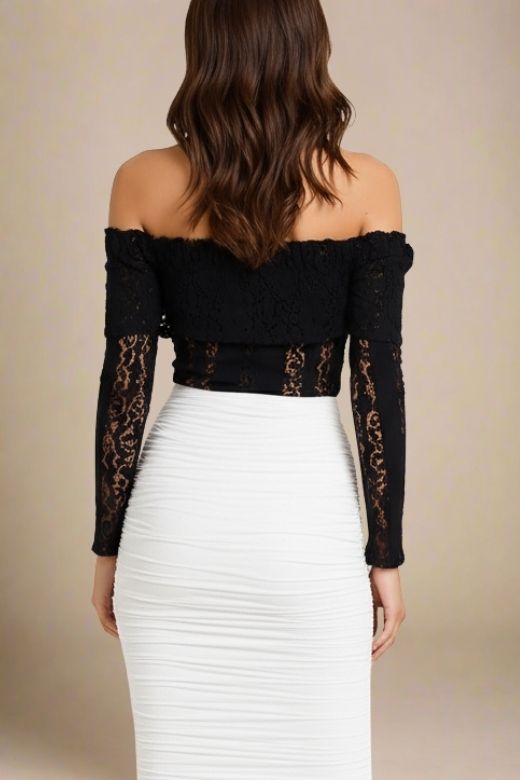 Woman wearing a figure flattering Rose Long Sleeve Top - Classic Black BODYCON COLLECTION