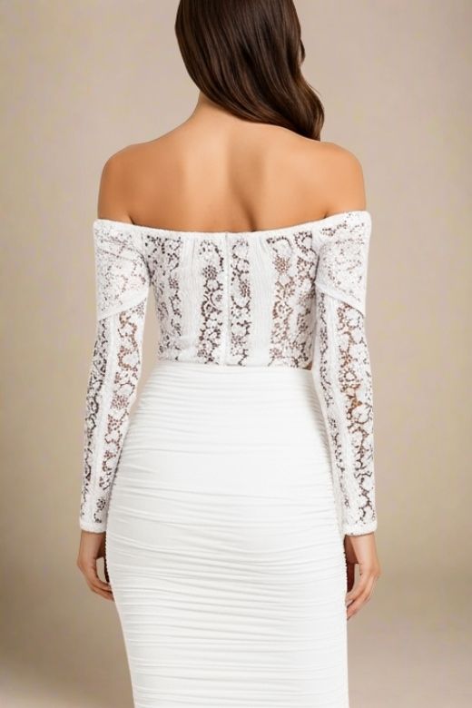 Woman wearing a figure flattering Rose Long Sleeve Top - White Pearl BODYCON COLLECTION
