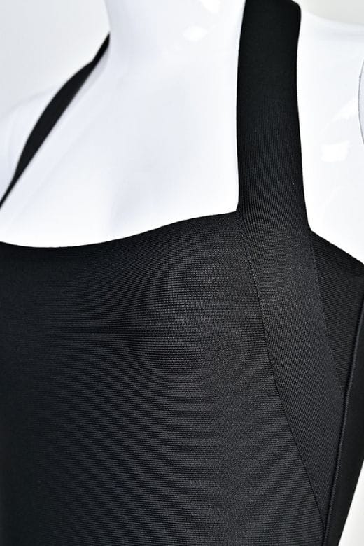 Woman wearing a figure flattering Raya Bodycon Midi Dress - Classic Black BODYCON COLLECTION Pty Ltd