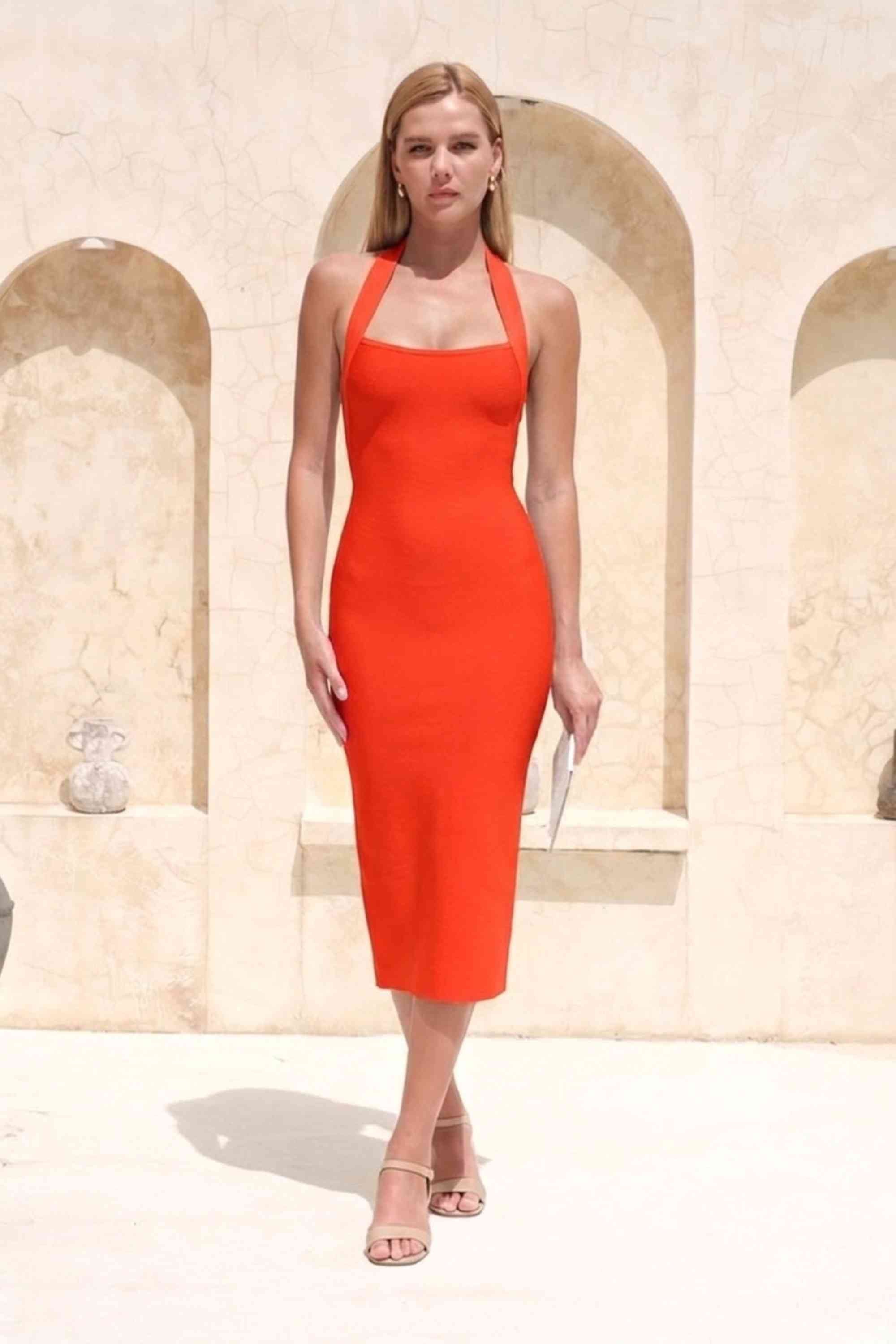 Woman wearing a figure flattering Raya Bodycon Midi Dress - Lipstick Red BODYCON COLLECTION Pty Ltd