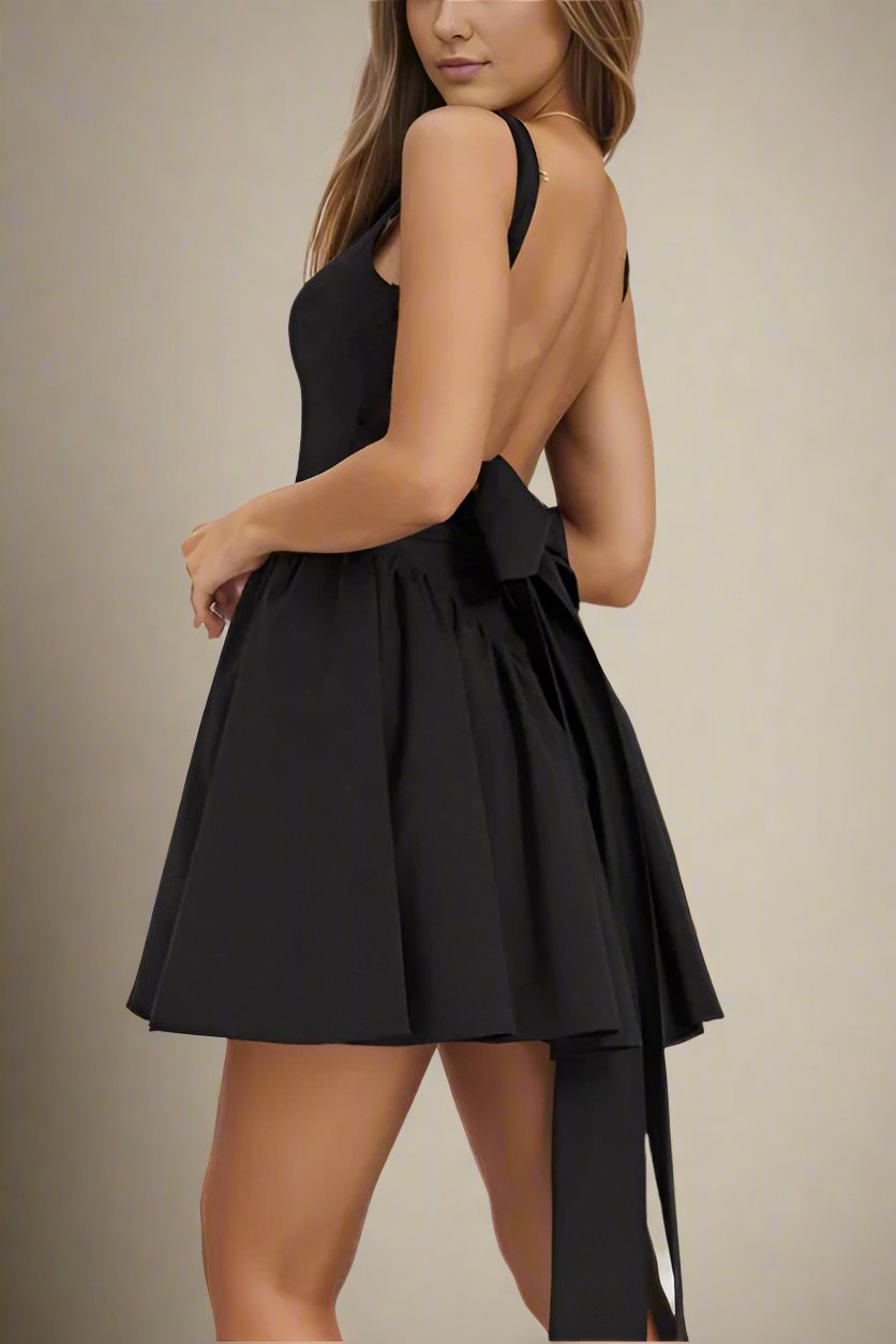 Woman wearing a figure flattering Rian Bodycon Mini Dress - Classic Black BODYCON COLLECTION