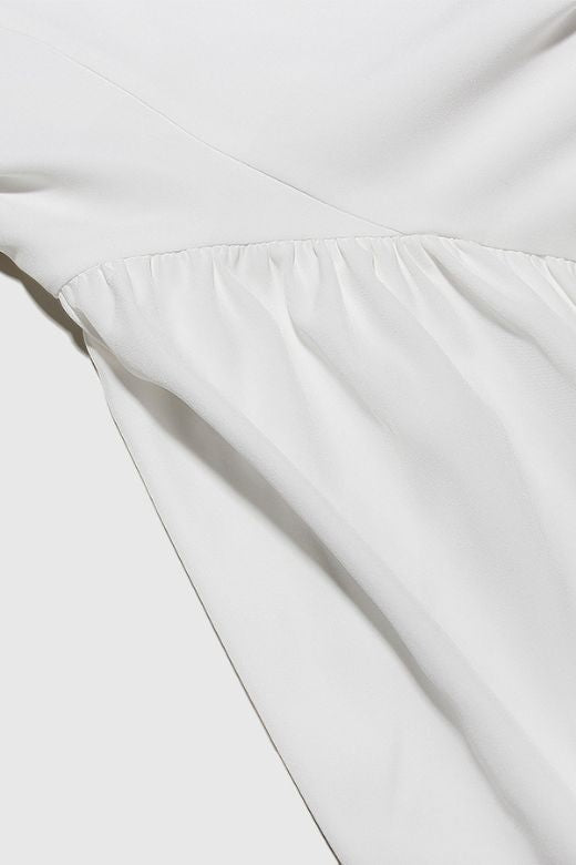 Woman wearing a figure flattering Rian Bodycon Mini Dress - Pearl White BODYCON COLLECTION