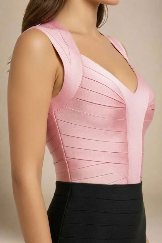 Woman wearing a figure flattering Sabrina Bandage Top - Dusty Pink BODYCON COLLECTION Pty Ltd