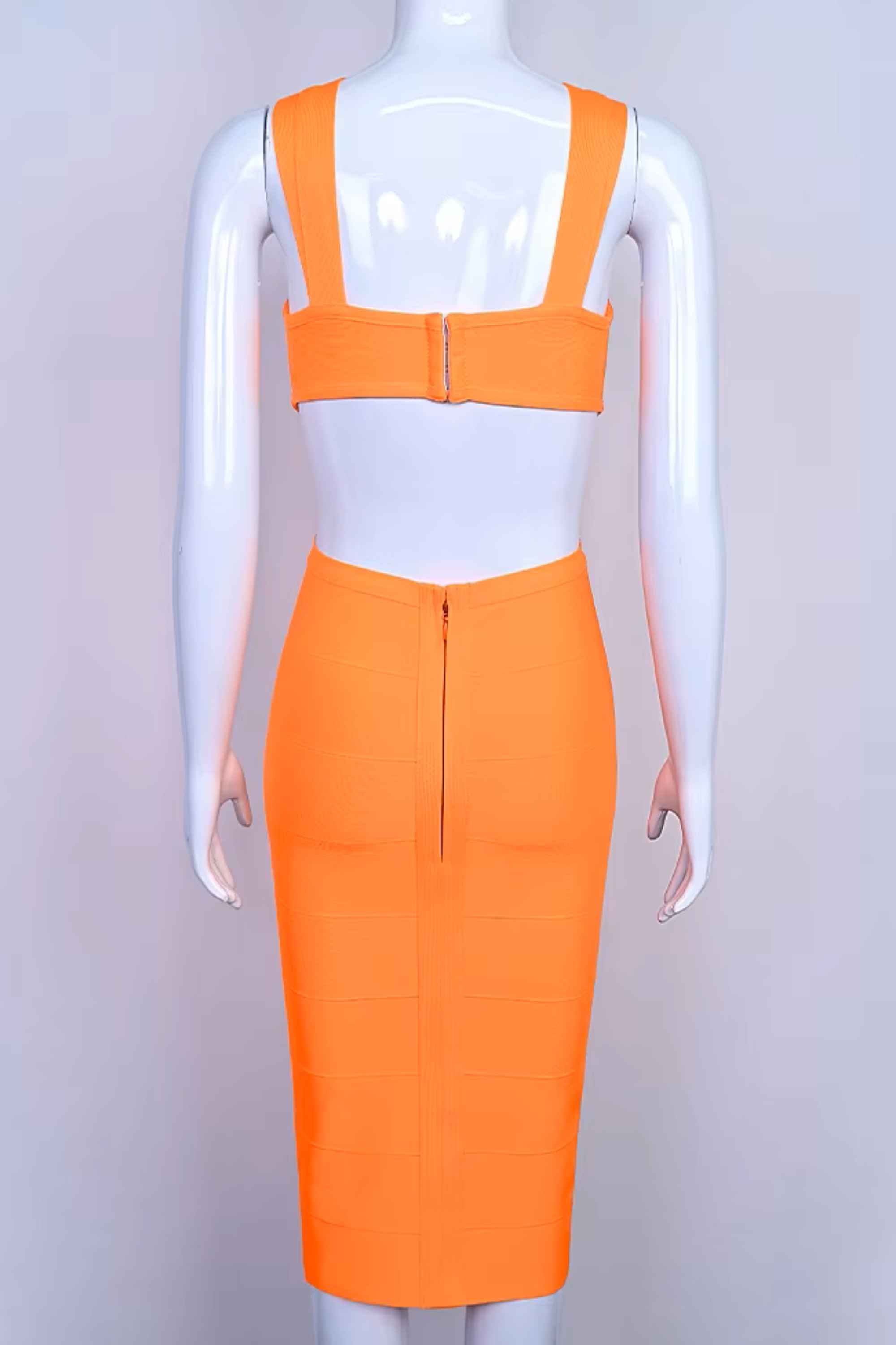 Woman wearing a figure flattering Sasha Bandage Midi Dress - Apricot Orange BODYCON COLLECTION