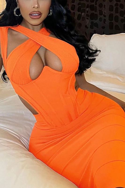 Woman wearing a figure flattering Sasha Bandage Midi Dress - Apricot Orange BODYCON COLLECTION