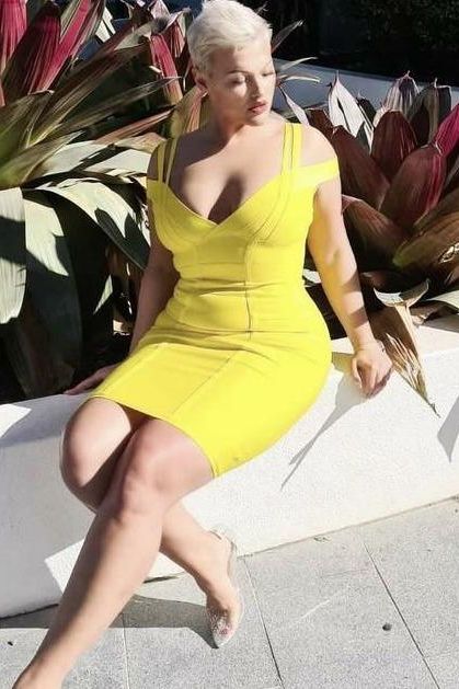 Woman wearing a figure flattering Sia Bandage Dress - Pearl White Bodycon Collection