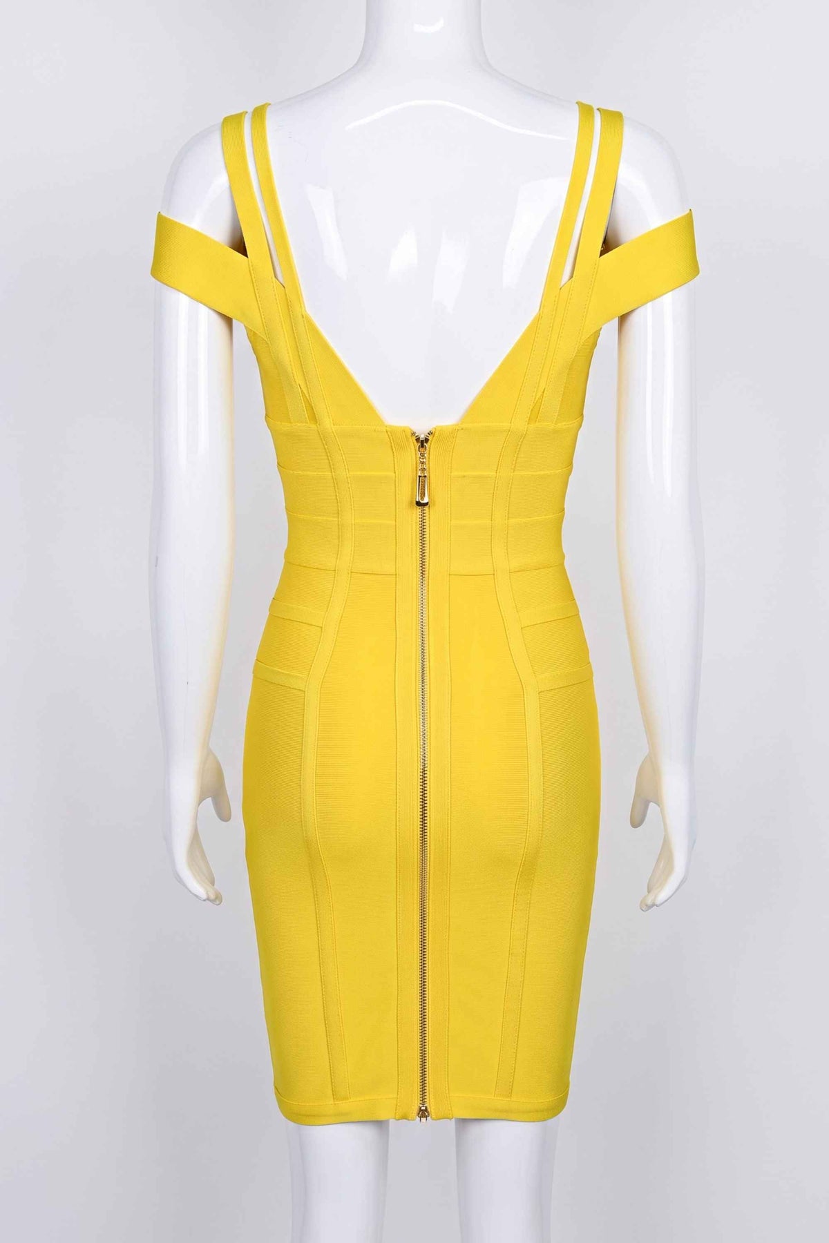Woman wearing a figure flattering Sia Bandage Dress - Sun Yellow Bodycon Collection
