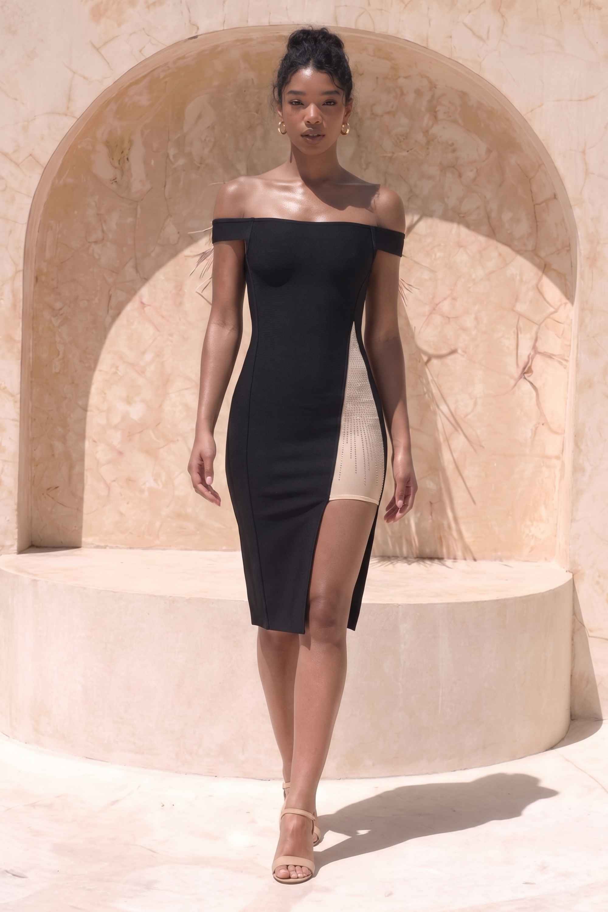 Woman wearing a figure flattering Sofie Off Shoulder Bodycon Dress - Classic Black BODYCON COLLECTION