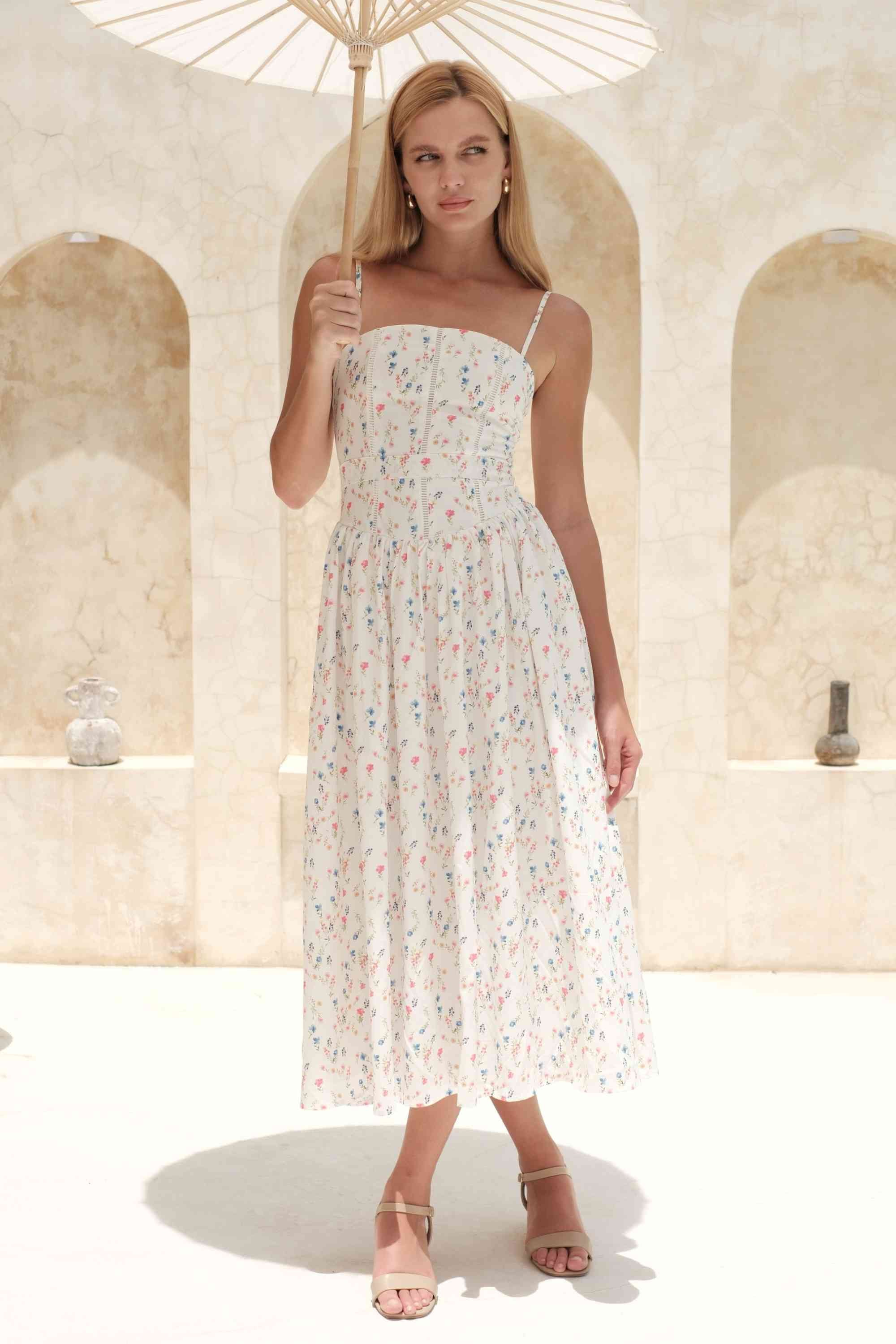 Woman wearing a figure flattering Tasmin Midi Dress - White Print BODYCON COLLECTION