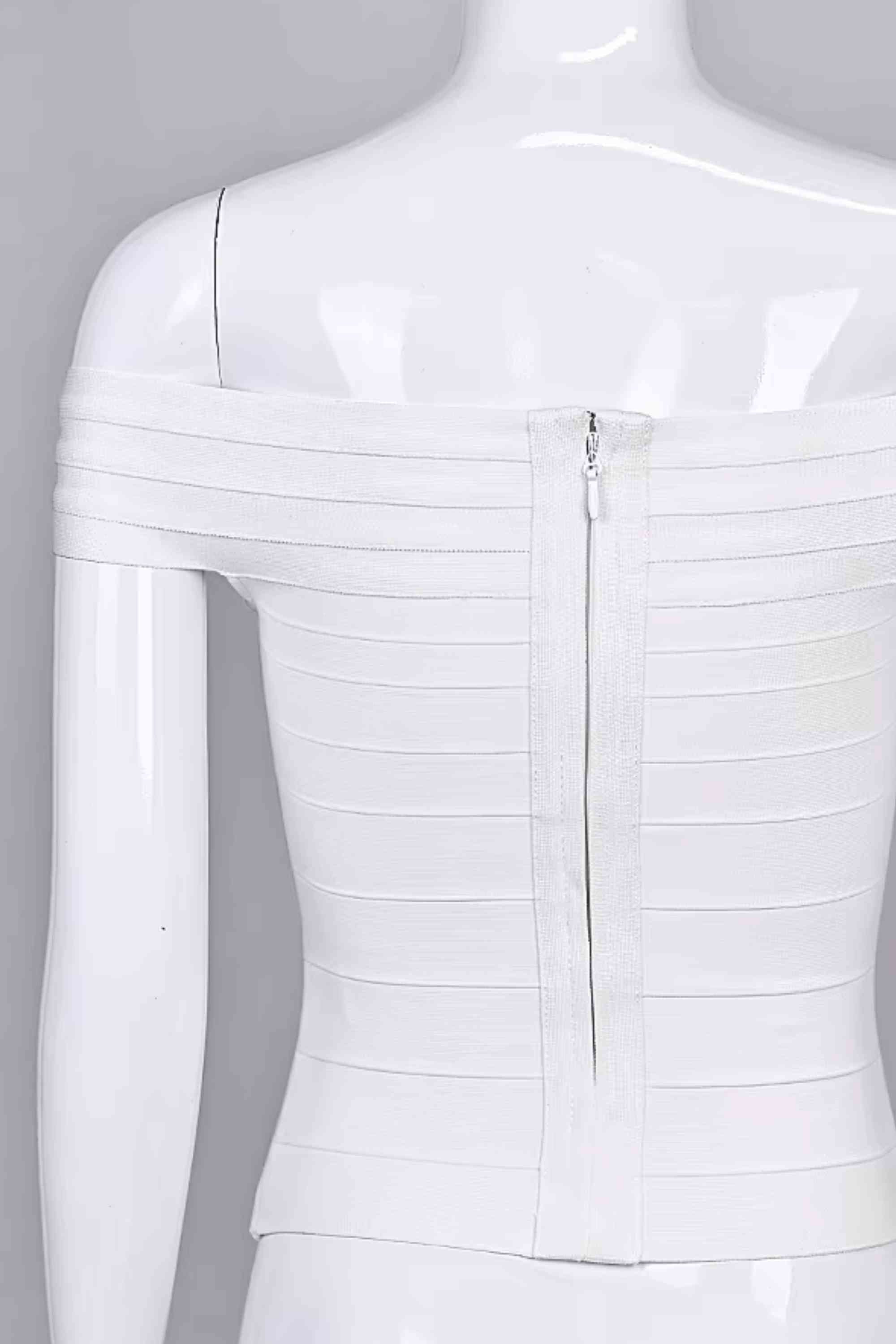 Woman wearing a figure flattering Vera Bandage Off Shoulder Top - White Pearl BODYCON COLLECTION Pty Ltd