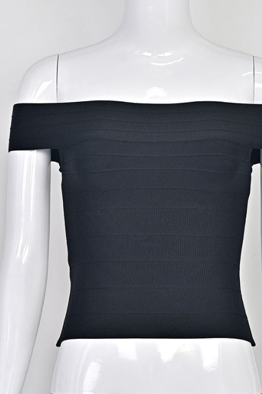 Woman wearing a figure flattering Vera Bandage Off Shoulder Top - White Pearl BODYCON COLLECTION Pty Ltd