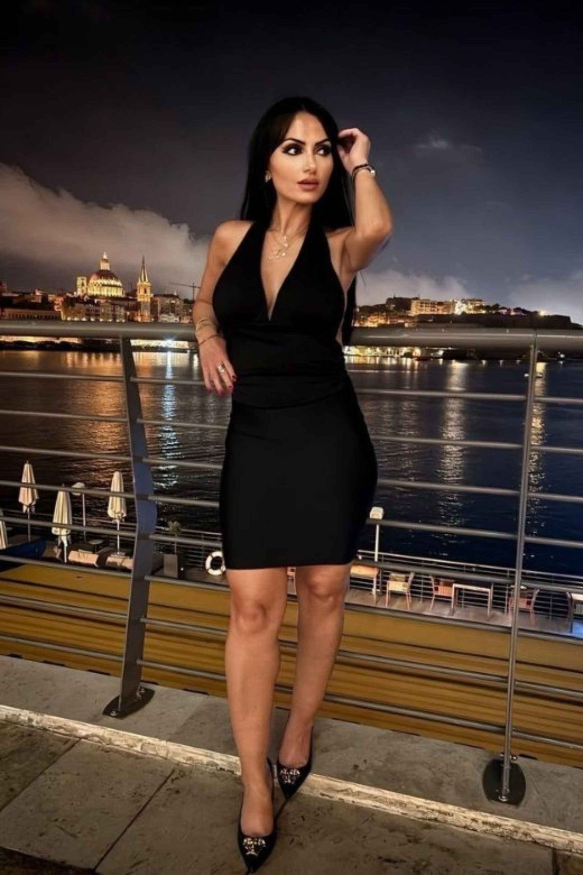Woman wearing a figure flattering  Aby Halter Neck Top - White Pearl BODYCON COLLECTION Pty Ltd