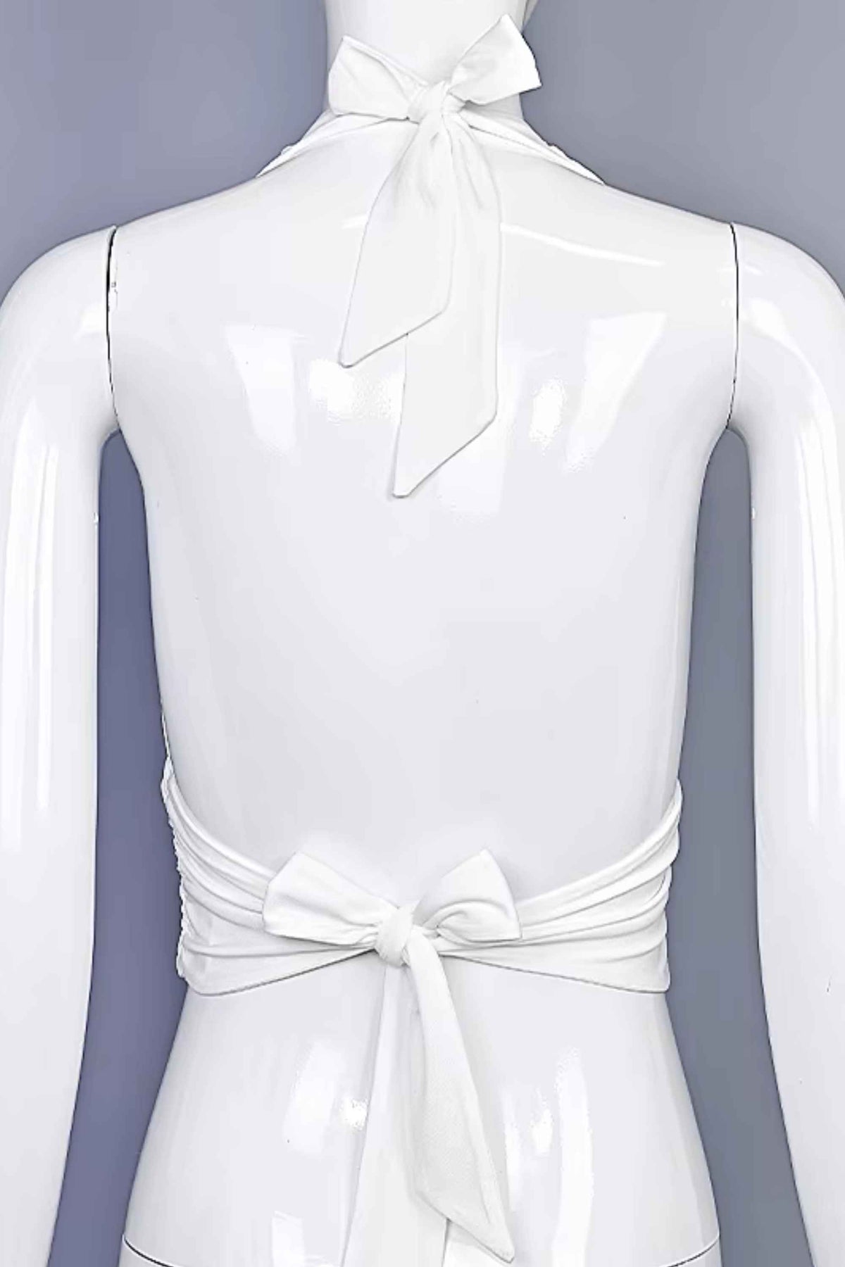 Woman wearing a figure flattering  Aby Halter Top - White Pearl BODYCON COLLECTION Pty Ltd