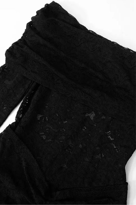 Woman wearing a figure flattering  Andie Long Sleeve Bodycon Wrap Jumpsuit - Classic Black BODYCON COLLECTION