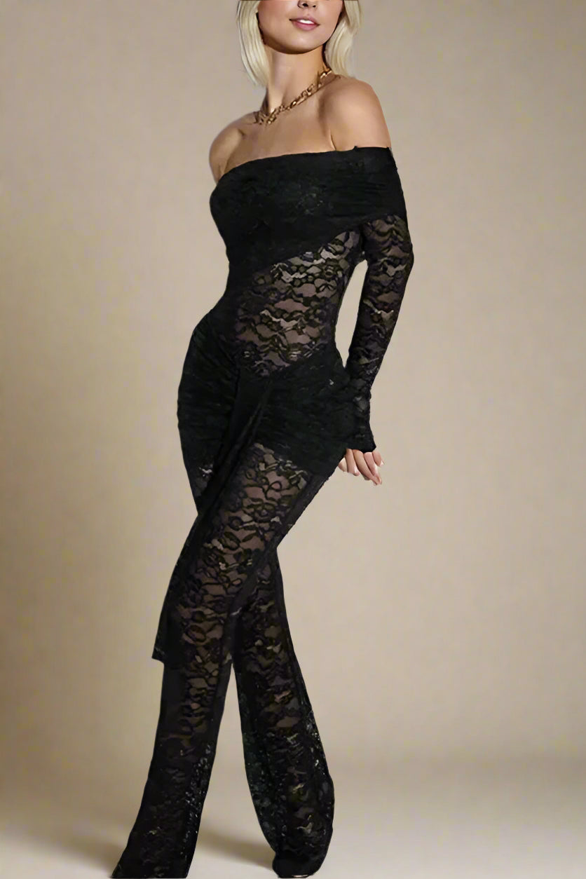 Woman wearing a figure flattering  Andie Long Sleeve Bodycon Wrap Jumpsuit - Classic Black BODYCON COLLECTION