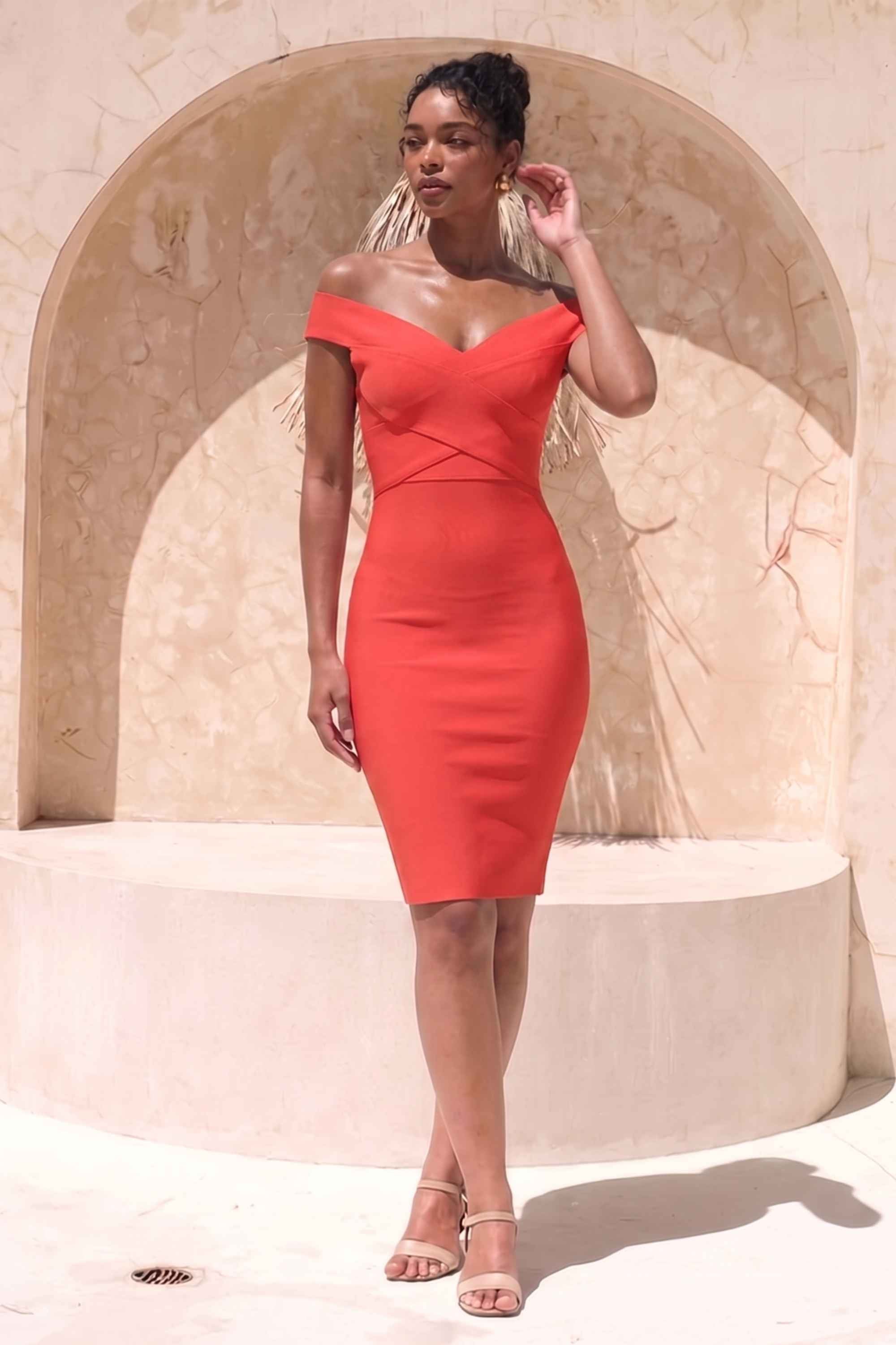 Woman wearing a figure flattering  Ash Bandage Dress - Lipstick Red Bodycon Collection
