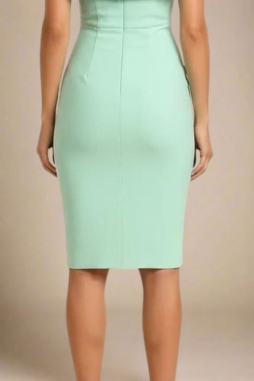Woman wearing a figure flattering  Bea Bandage Dress - Mint Green Bodycon Collection