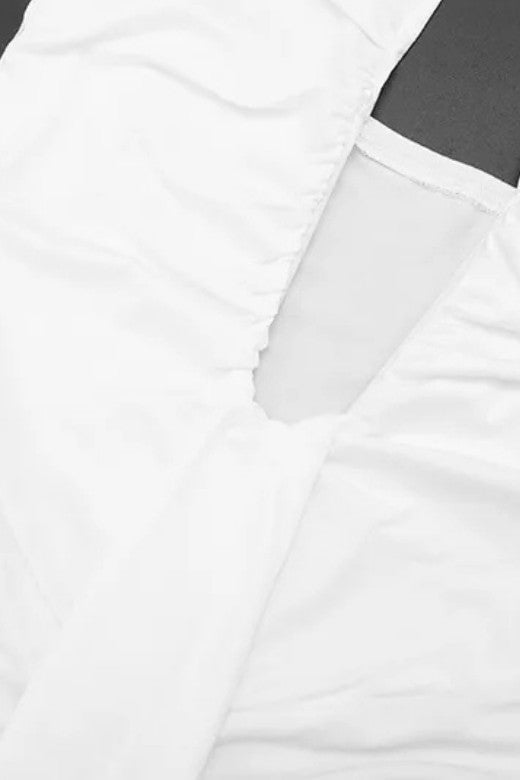 Woman wearing a figure flattering  Bella Bodycon Wrap Maxi Dress - White Pearl BODYCON COLLECTION Pty Ltd