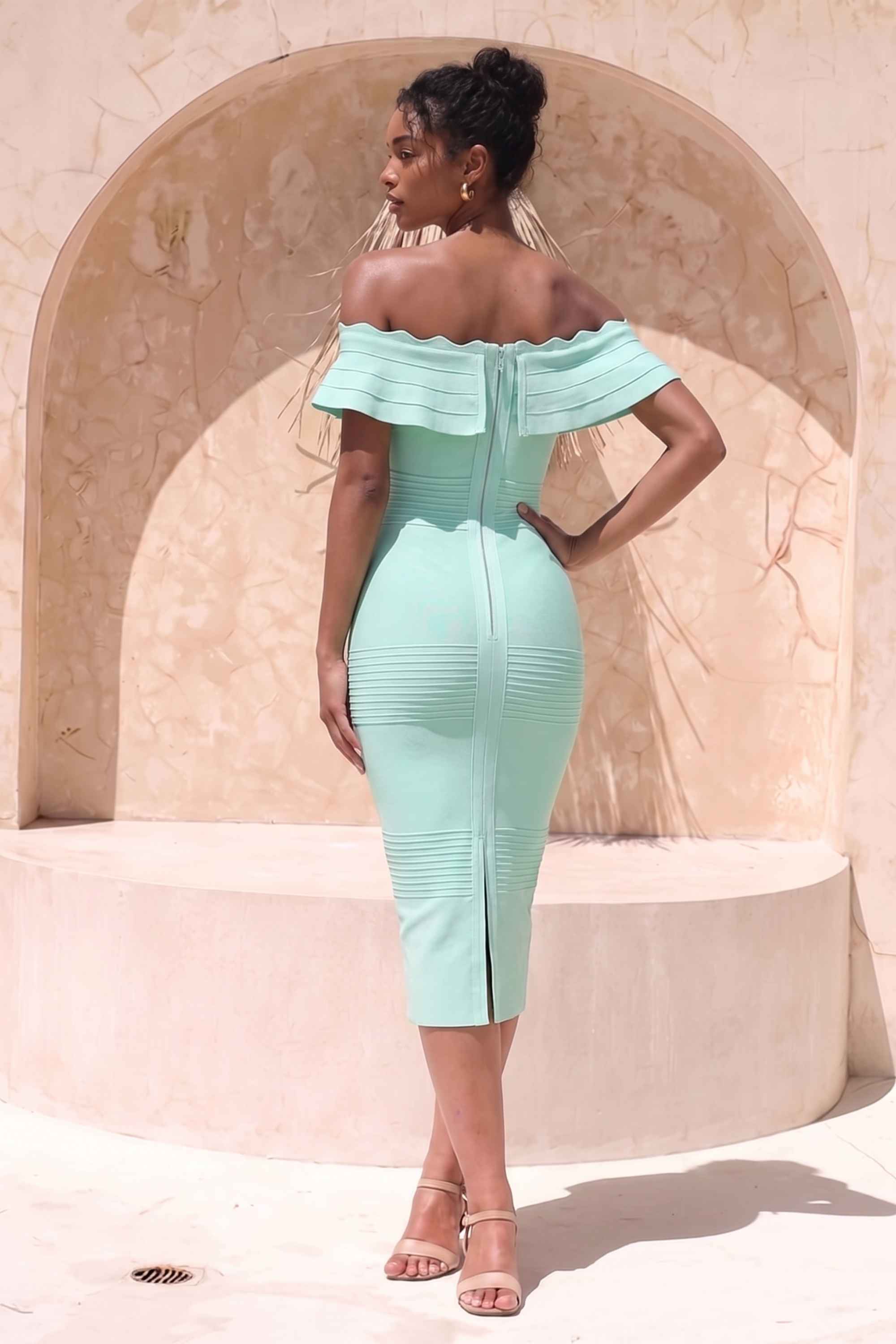 Woman wearing a figure flattering  Billie Bandage Midi Dress - Mint Green Bodycon Collection