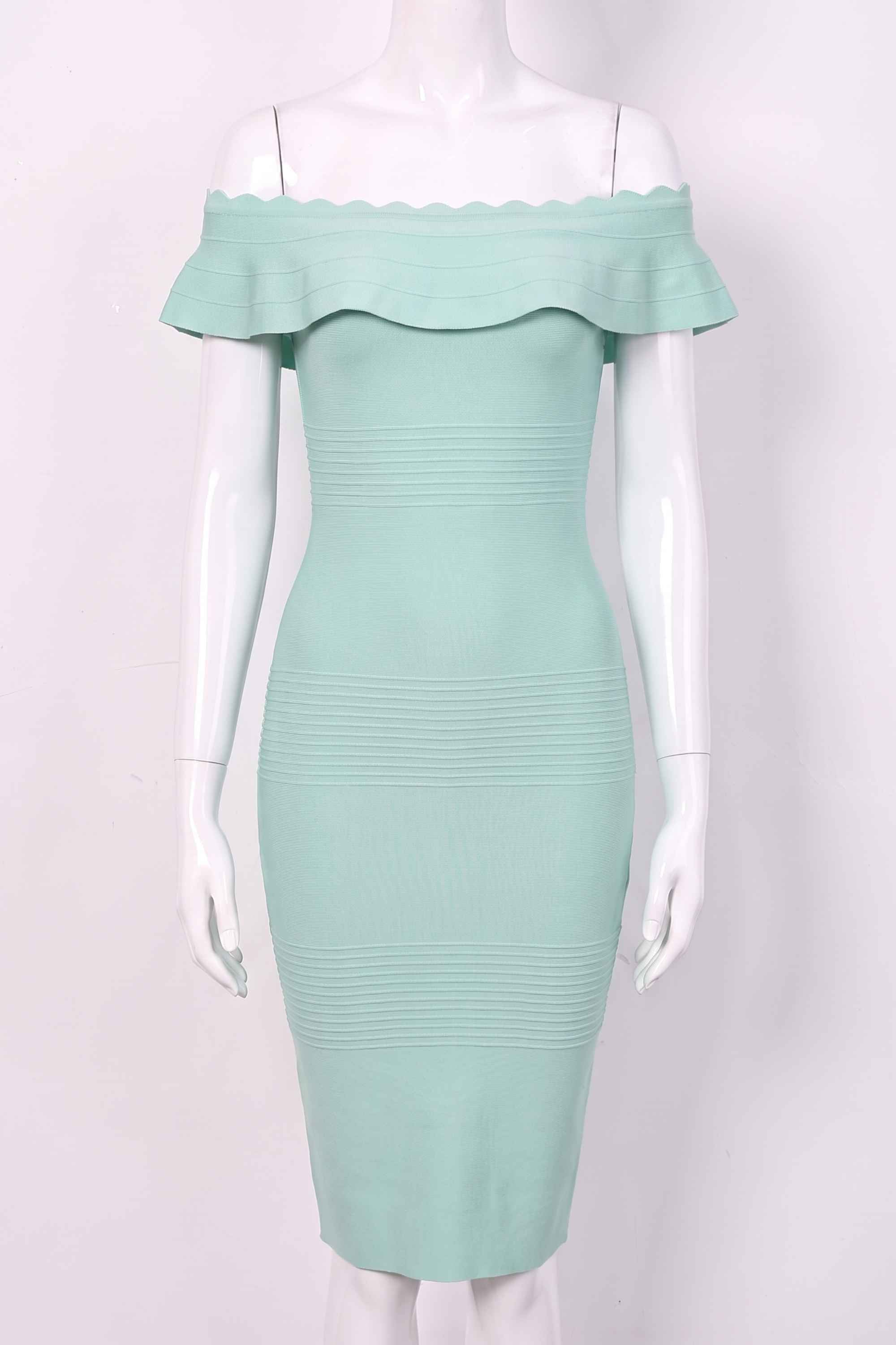 Woman wearing a figure flattering  Billie Bandage Midi Dress - Mint Green Bodycon Collection