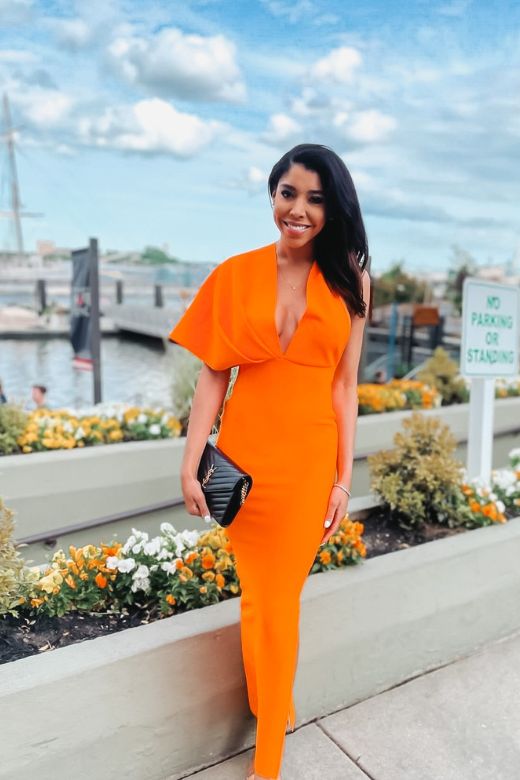 Woman wearing a figure flattering  Blake Bandage Maxi Dress - Apricot Orange BODYCON COLLECTION