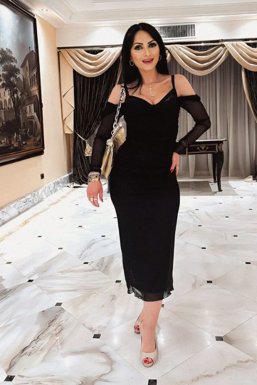 Woman wearing a figure flattering  Brianna Bodycon Long Sleeve Maxi Dress - White Pearl BODYCON COLLECTION